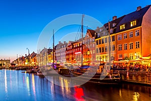 View of the old Nyhavn canal of Copenhagen in the evening sunset