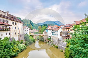 View at the Old part of Skofja Loka with Cappuchin bridge over Selca Sora river - Slovenia photo