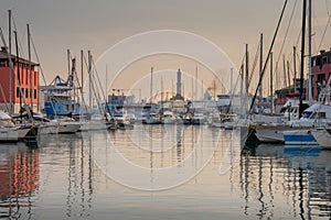 View of the old port of Genoa at sunset with Lanterna lighthouse, Italy.