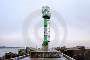 View of the old rusted metal lighthouse on the Vistula Spit on the Baltic Sea. Russia