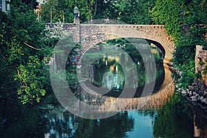 view of old stone bridge over river