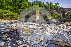 View of old stone bridge over river