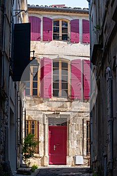 View on old streets and houses in ancient french town Arles, touristic destination with Roman ruines, Bouches-du-Rhone, France