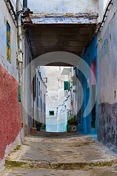 View of the old streets of Tetouan Medina quarter in Northern Morocco. A medina is typically walled, with many narrow and maze-
