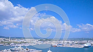 View from the old town Dalt Vila to the port and new town in Ibiza, Spain. Ships and boats in the harbor. Ibiza Town