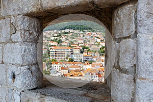 View of the old town of Dubrovnik through an opening in the wall of the fortress in Croatia