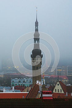 View of the old town in foggy weather. Town Hall spire. Toompea district. Tallinn, Estonia