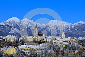 View of old town Kranj and snow covered mountain peak of Grintovec and Skuta