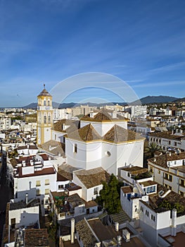 view of the old town of Marbella with sierra blanca in the background