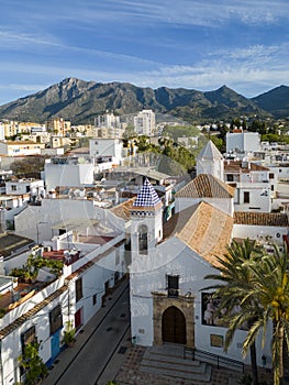 view of the old town of Marbella with sierra blanca in the background