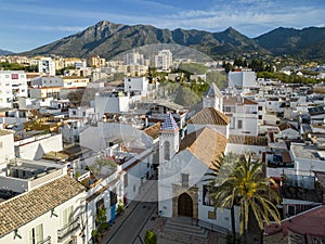 view of the old town of Marbella with sierra blanca in the background