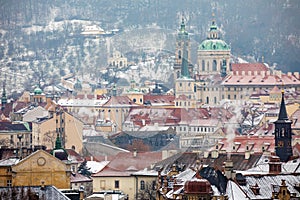View of Old Town Prague City in snowy foggy day in the winter, Czech republic