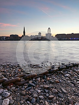 View of the old town with the promenade in the city of Dusseldorf from the bank river Rhine. Beautiful panorama of the city.