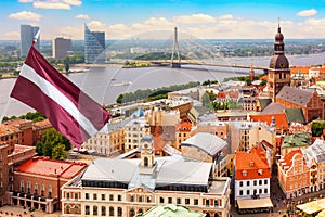 View of the Old Town Ratslaukums square, Roland Statue, The Blackheads House and St Peters Cathedral against blue sky in Riga,