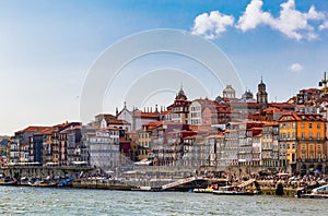 View of Old town skyline from across the Douro River. Front view of the Ribeira historical district. Colorful Houses. Porto.