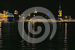 View of the old town of Tallinn, Saint Olaf church and cruise liner at the night, Estonia