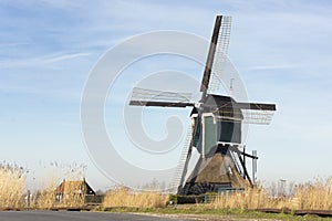 View on an old tradional windmill in the Netherlands, part of historic Dutch culture