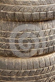 View of old tyres stacked over one another