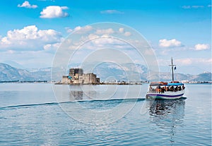 View of old Venetian fortress and old prison, Bourtzi at the sea. Argolis bay, Nafplio - Greece