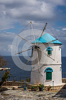 View of the old white windmill in Skinari Cape