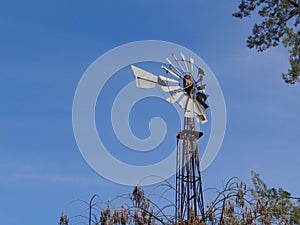 View of an old wind mill with a deep blue sky