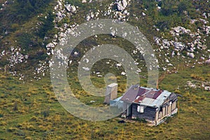 View of old wood house from Mount Baldo terminal in a misty day, Italy