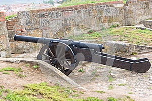 View of old wooden-based cannon on the Cuidad Rodrigo fortress photo
