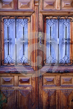 View of old wooden door of building, spanish village style