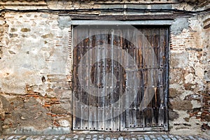 View of an old wooden gate in Oropesa, Spain