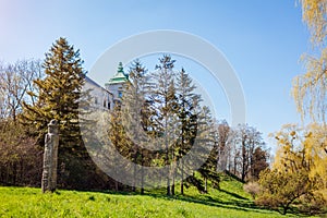 View of Olesko Castle from spring garden. Ancient architecture in Western Ukraine. Traveling in Lviv region