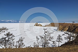 The view from Olkhon island on lake Baikal, Shamanka rock and Cape Burkhan in winter sunny day. Irkutsk region, Eastern Siberia,