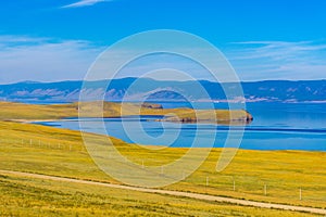 View from Olkhon island to Maloe More strait of lake Baikal and mainland near Yalga village. Picturesque summer landscape,