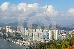 View of one of the districts of Sanya city. Visible are the skyscrapers and the public ferry terminal. Hainan, China