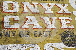 View of the Onyx Cave mural painted on an old brick building wall in Eureka Springs, Arkansas