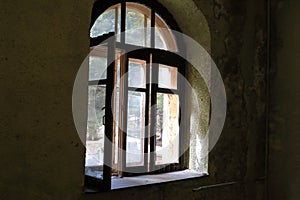 View of open broken window of building