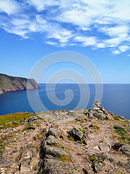 The view of the open and calm atlantic ocean along the sugarloaf trail in Newfoundland and Labrador, Canada