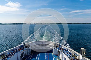 View of the open ocean with the wake of a large passenger ferry