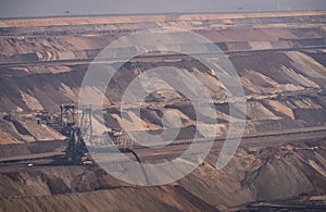 View into the open pit of Garzweiler surface mine with heavy machinery and excavated material