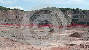 View in an open pit mine quarry. porphyry rocks. camera pan.