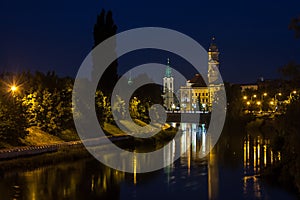 View of Oradea City Hall tower and river Crisul Repede in night