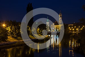 View of Oradea City Hall tower and river Crisul Repede in night photo
