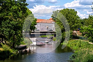 View of Oranienburg Castle with the banks of the river Havel in the foreground