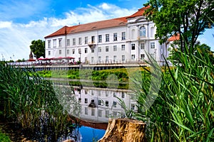 View of Oranienburg Castle with the banks of the river Havel in the foreground