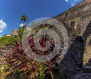A view of the original town wall in Saint Pierre damaged by the 1902 eruption of the volcano, Mount Pelee in Martinique