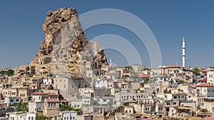 View of Ortahisar town old houses in rock formations from Ortahisar Castle aerial timelapse.