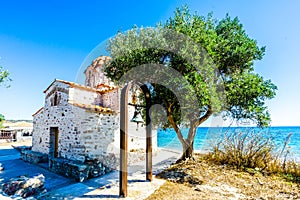 View on Orthodox church Agia Varvara at Skoutari beach, Peloponnese Greece
