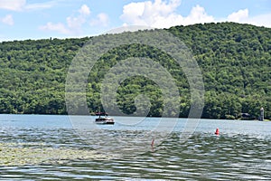 View of Otsego Lake from Sam Smiths Boatyard in Cooperstown, New York photo
