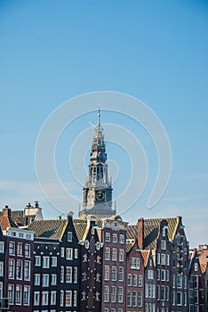View of Oude Kerk Old Church from across the Oudezijds Voorburgwal canal in Amsterdam, Netherlands