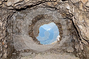 View out of a loophole of the Mount Lagazuoi tunnels, built during the First World War, Dolomite Alps in South Tirol