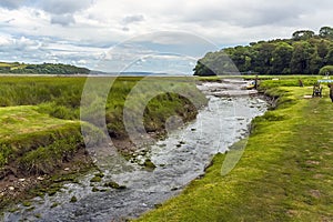 A view out to sea down the River Coran at Laugharne, Wales photo